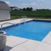 rectangular pool in backyard