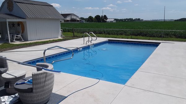 rectangular pool in backyard