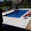 rectangular pool in backyard with slide