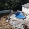 Backyard inground pool mid construction