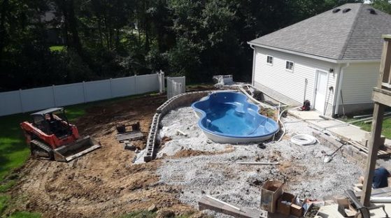 Backyard inground pool mid construction